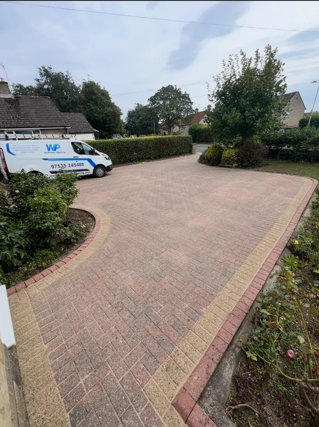 Pressure-washed outdoor paving after dirt and organic growth were removed