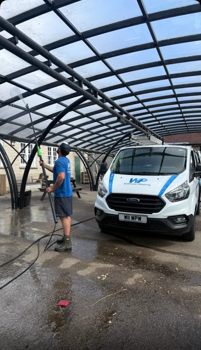 WillPower Washing van and cleaning work beneath a glass canopy