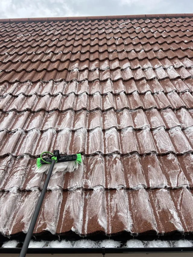 Roof tiles being treated during cleaning